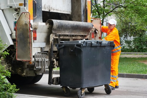 Man and van leaving a cleared driveway after job completion